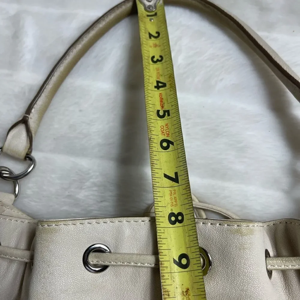 Michael Michael Kors leather beige drawstring bucket satchel.silver tone accents